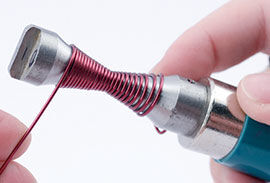 Continuing wrapping the wire around the mandrel to the other side